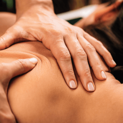 Therapist performing a deep shoulder massage at Anantara Spa